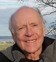 a small headshot of plotnik an older white man standing outside and smiling