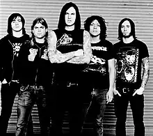 As I Lay Dying in 2006. From left to right: Phil Sgrosso, Jordan Mancino, Tim Lambesis, Nick Hipa, and Clint Norris.