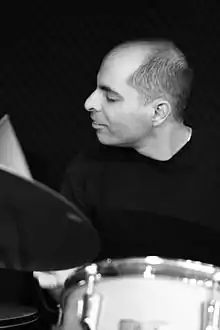 Sirkis playing the drums in 2014