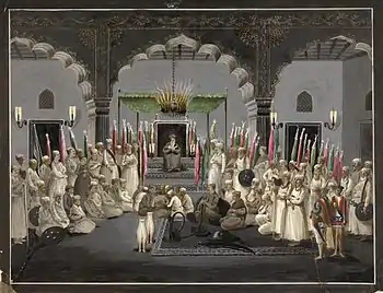 An Imam reads verses from the Quran after Isha' (night prayers) in the Mughal Empire