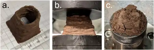 3D-printed Astrocrete samples. (a) after fabrication, (b) during compression testing, and (c) after compression testing.