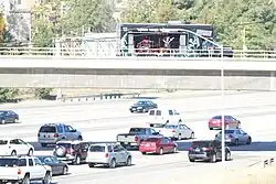 The Athiarchists performing on an overpass above the 405 Freeway in Irvine, California