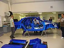 A racecar bodyshell with integrated roll cage