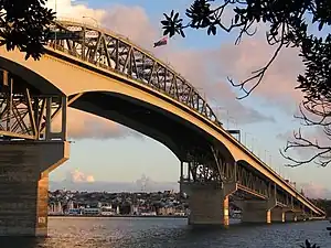 The suburb and Westhaven Marina seen under the Auckland Harbour Bridge from the North Shore.