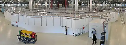 Image 15Australian SynchrotronPhoto credit: John O'NeillA panoramic view across the interior of the Australian Synchrotron (a subatomic particle accelerator) in Clayton, Victoria. Dominating the image is the storage ring, showing the  optical diagnostic beamline at front right. In the middle of the storage ring is the booster synchrotron and linac. The yellow, green and red magnets on the trolley (front left) are a demonstration of the bending and focusing magnets used in the storage ring to produce the synchrotron radiation and maintain the electron beam.More selected pictures