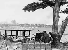 Image 11Australian anti-tank gunners overlooking the Johor Causeway between Singapore and Malaya in February 1942 (from Military history of Australia during World War II)