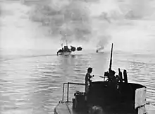 Image 60HMAS Australia and Arunta bombarding Cape Gloucester (from Military history of Australia during World War II)