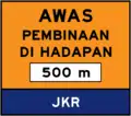 Attention, construction ahead sign with 500 m