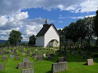 View of the Old Bø Church on the other side of the cemetery