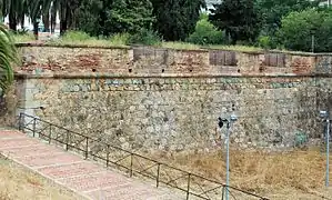 End of north curtain wall with embrasures and descent to the moat