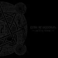 A black album cover, with one half of a circular design on the left side and the words "LIVE AT BUDOKAN" and "~BLACK NIGHT~" on the right side, both in a lighter black color.