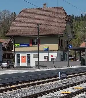 Three-story building with gabled roof