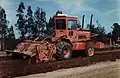 A Bomag MPH100 soil stabilizer aerating the soil ready for blending with lime