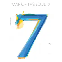 Large blue and yellow number seven in the center of a white square with "Map of the Soul: 7" written above it in grey lettering and all uppercase.