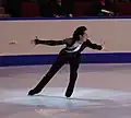 Clockwise back crossover, during the scissoring motion after the wide step.(Johnny Weir)