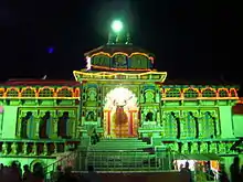 image of the temple at night illuminated with green light