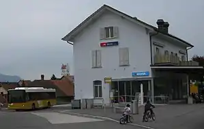 Three-story building with gabled roof