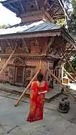 Women observing temple affected by the earthquake