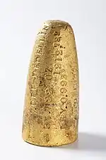 Gold bar from Medellín melted into the shape of a projectile, 1944