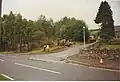 A picture Balnain in 1998. The Shelter by the workmen is the new 1990s bus shelter and the white concrete shelter behind the van is the old 1970s bus shelter.