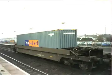 A tiphook wagon loaded with one intermodal container (double stack is not possible in the United Kingdom)