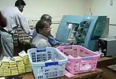 Banknote processing in an Indian cash center with BPS 200 from G+D (2004)