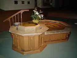 The baptismal font at St. Raphael's Cathedral, Dubuque, Iowa, was expanded in 2005 to include a small pool for immersion of adults.