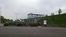 Glass entrance to station with bikes in front