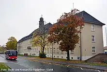 A photograph of the HQ building in Barker Barracks Paderborn c2016. To the right of the building is the memorial wall of 35 Engineer Regiment.