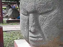 Stone heads in the central park