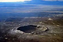 Image 29Meteor Crater in Arizona. Created 50,000 years ago by an impactor about 50 metres (160 ft) across, it shows that the accretion of the Solar System is not over. (from Formation and evolution of the Solar System)