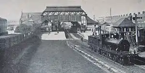 The original station building, viewed from the south in the early 1910s. Note the all-over roof.