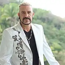 Portrait of Barry Cooper wearing a white jacket