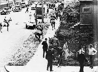 Image 28Mounted police chase demonstrators through Vancouver's East End during the Battle of Ballantyne Pier in 1935.