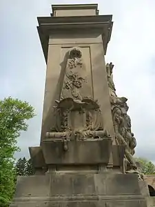 The south facade; the sides of the monument show the seal of the United States and the original thirteen colonies.