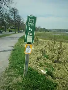 A distance marker on the western side of Baxter Boulevard.