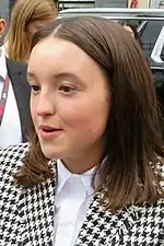18 year-old girl talking to something to the left.