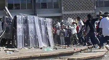 Image 22Riot police and protesters during the unrest in 2005. (from History of Belize)