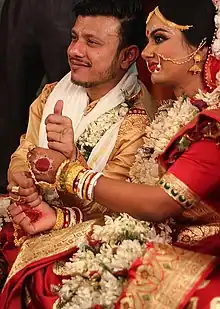 A Bengali Hindu couple during their wedding ceremony.