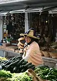 Berber woman selling produce at a Moroccan market