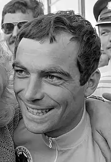 Black-and-white photo of Hinault's face, smiling