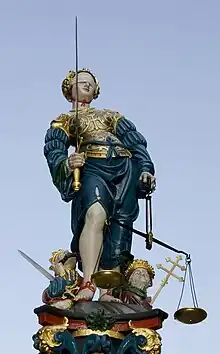 Lady Justice with sword, scales and blindfold on the Gerechtigkeitsbrunnen in Berne, Switzerland—1543