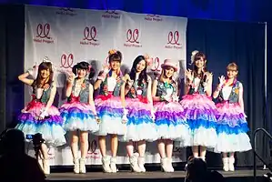 Berryz Kobo in 2012. From left to right:Shimizu, Tsugunaga, Tokunaga, Sudo, Natsuyaki, Kumai, and Sugaya.