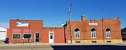 three one-story brick buildings