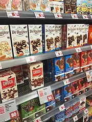 Hagelslag, muisjes and vlokken on display in a Dutch supermarket.