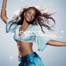 A African-American woman is standing with her arms open, meanwhile smiling and looking back. She wears a short light-blue shirt, a blue skirt and a rosary on her neck, the names "Beyoncé", "Sean Paul" and title "Baby Boy" in the centre.