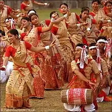 Dancers and drummers in colourful costumes