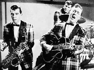 Image 5Bill Haley and his Comets performing in the 1954 Universal International film Round Up of Rhythm (from Rock and roll)