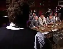 Bill Brasky stares down at the gang in the skit "Holiday Inn"