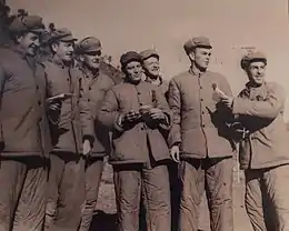 Several American prisoners of war at a Korean POW camp